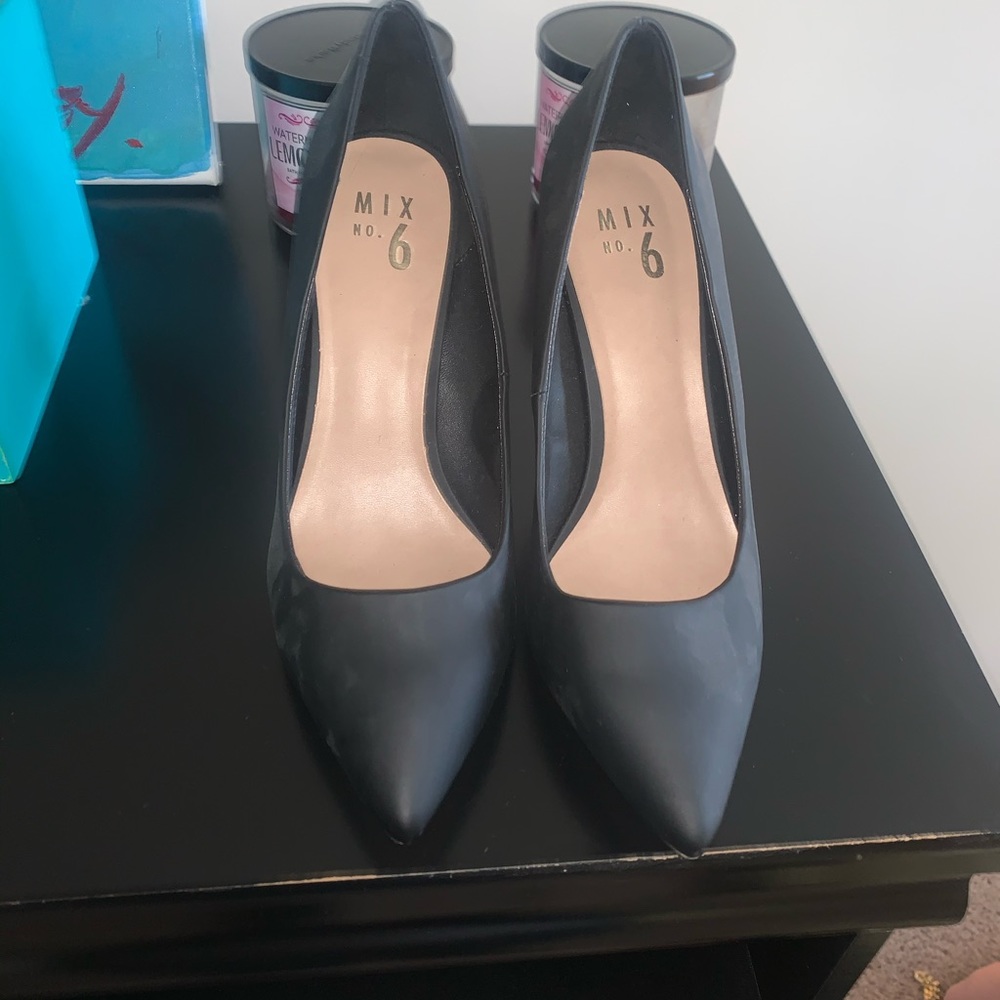 A pair of Matt black pumps